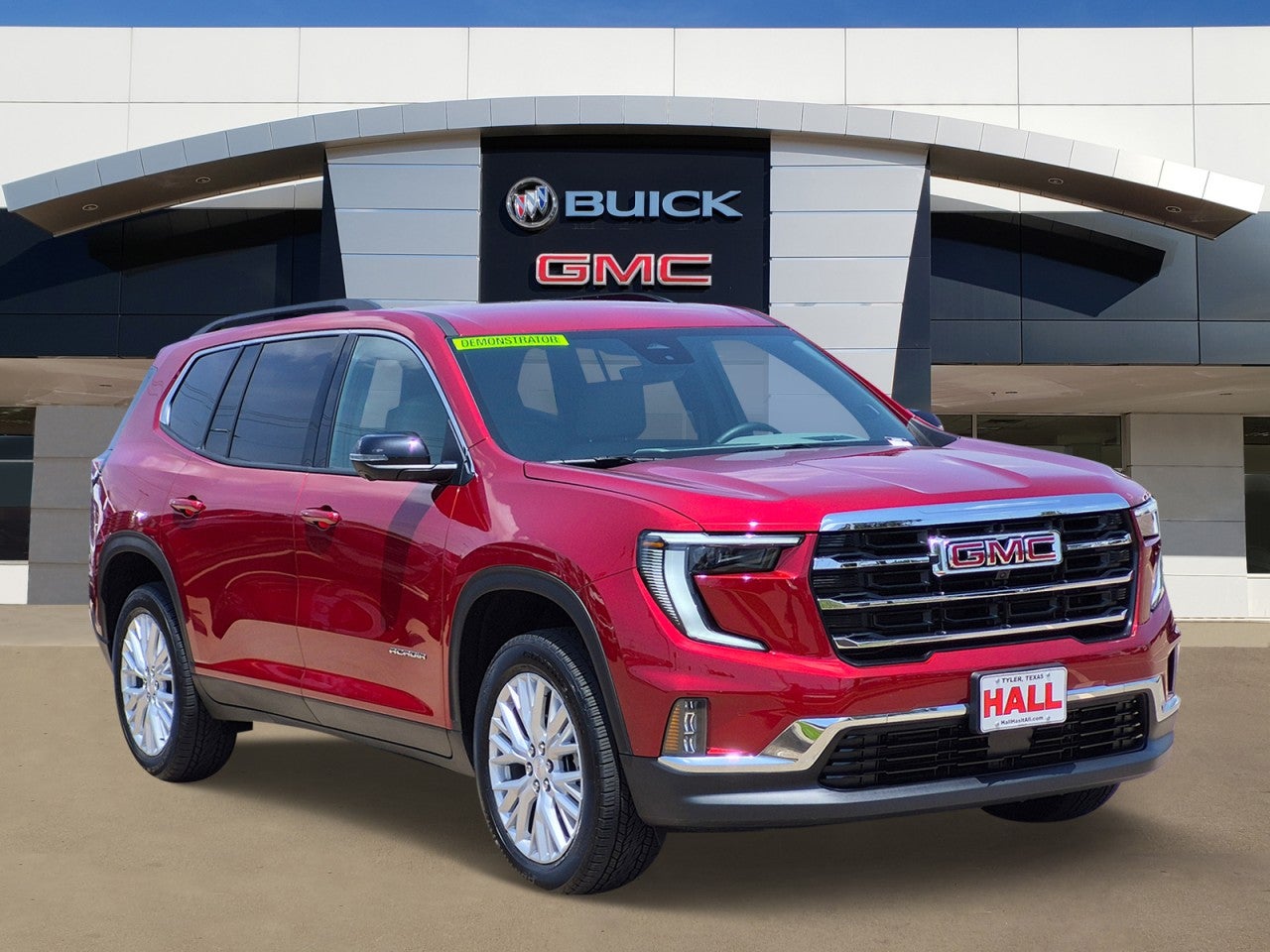 2026 GMC Acadia Elevation in Volcanic Red Tintcoat — front three-quarter view
