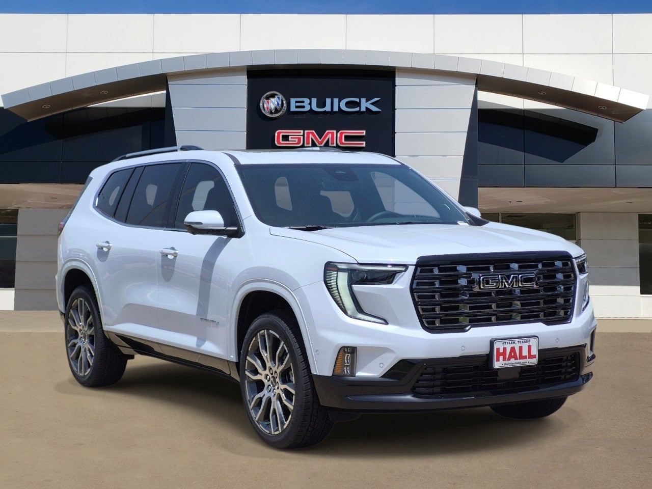 2026 GMC Acadia Denali Ultimate in Glacier White Tricoat — front three-quarter view