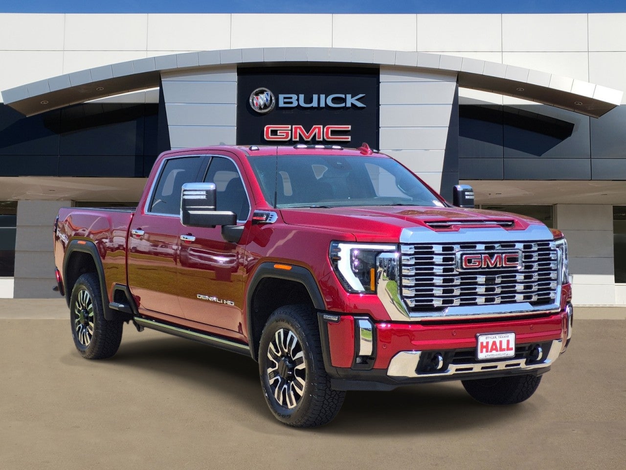 2024 GMC Sierra 2500 HD Denali in Volcanic Red Tintcoat — front three-quarter view