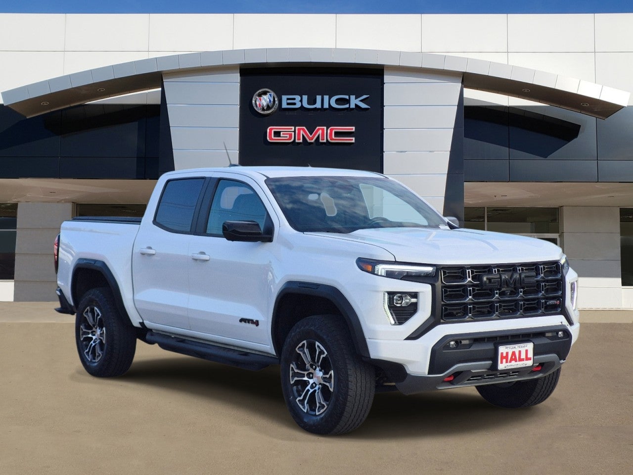 2023 GMC Canyon AT4 in Summit White — front three-quarter view