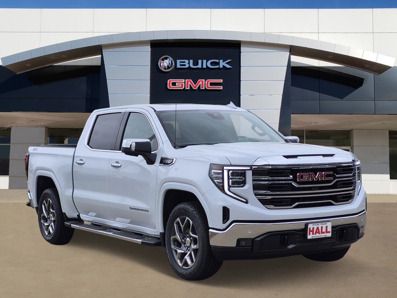 2026 GMC Sierra 1500 SLT in Glacier White Tricoat — front three-quarter view