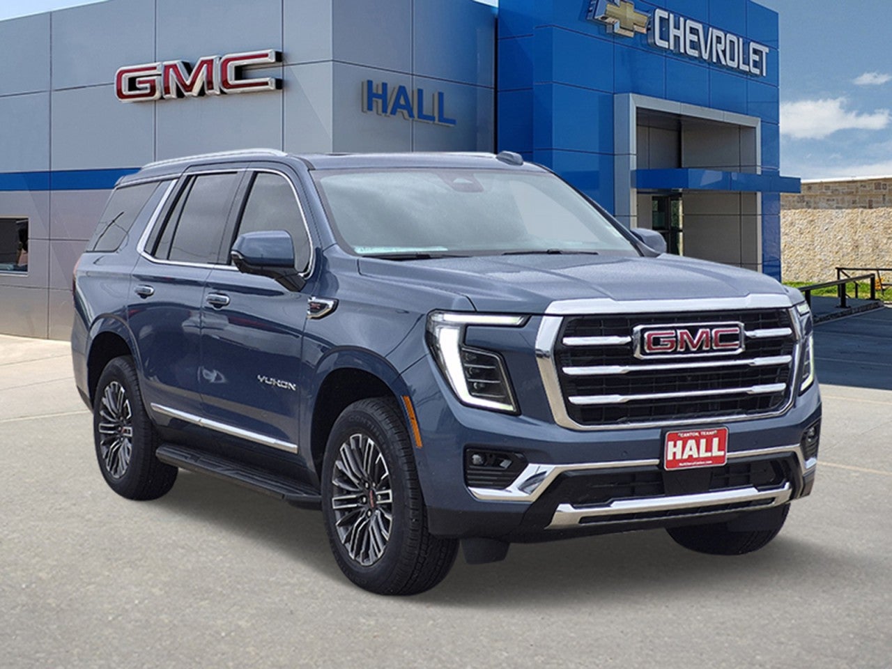 2026 GMC Yukon Elevation in Downpour Metallic — front three-quarter view