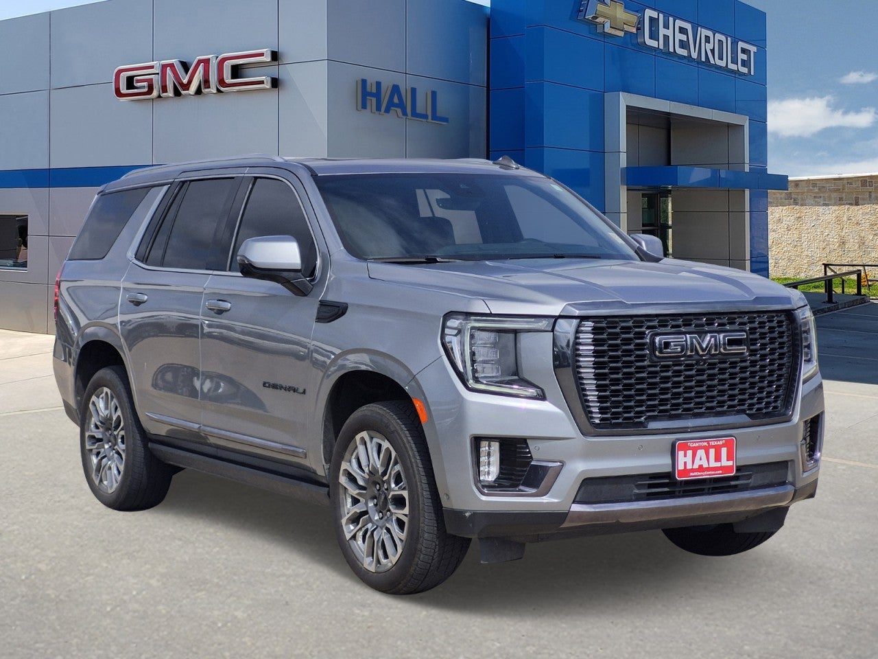 2024 GMC Yukon Denali Ultimate in Sterling Metallic — front three-quarter view