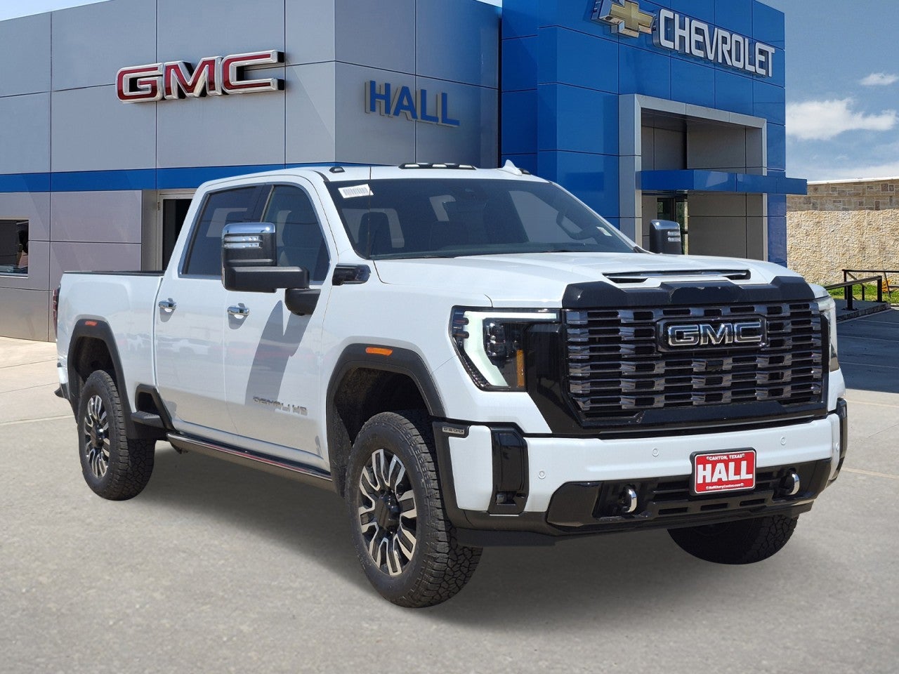 2026 GMC Sierra 2500 HD Denali Ultimate in Glacier White Tricoat — front three-quarter view