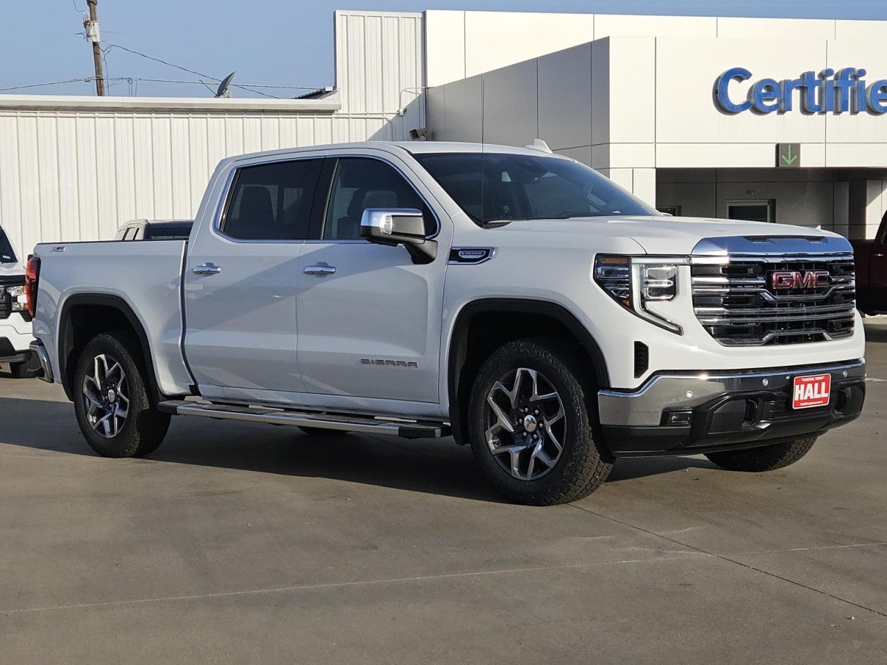2026 GMC Sierra 1500 SLT in Summit White — front three-quarter view